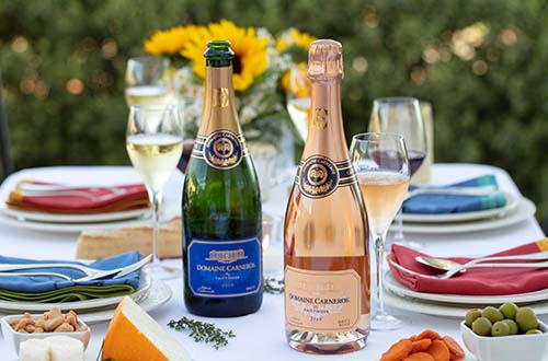 summer table setting with brut rose and snacks