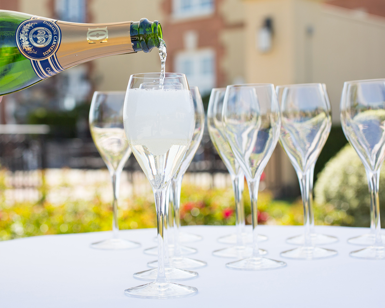 Pouring glasses of Brut